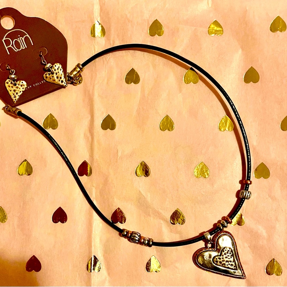 Darling heart necklace and matching earrings.  Never worn. Still with tags.